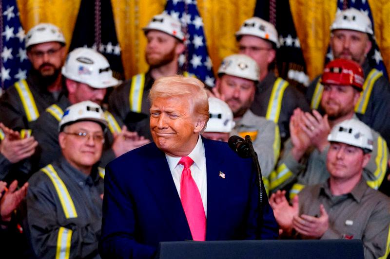 FILEpix U.S. President Donald Trump reacts next to coal industry workers, on the day he signs energy-related executive orders at the White House in Washington, D.C., U.S., April 8, 2025. REUTERSpix