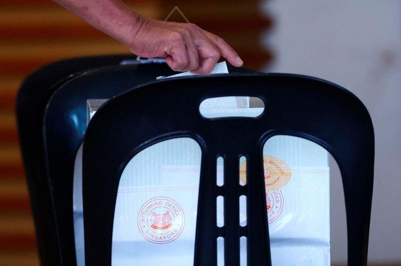 A person votes at a polling station during the general election, in Singapore May 3, 2025. - REUTERSPIX