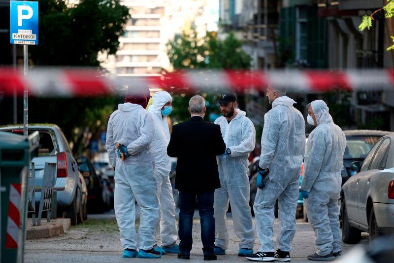 Forensics officers investigate the area of a blast caused by an explosive device outside a bank that killed a 38-year old woman, in Thessaloniki, Greece, May 3, 2025. REUTERSpix