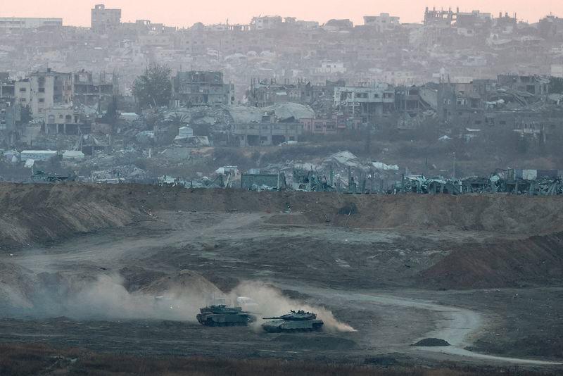 Israeli tanks operate in Gaza, by the Israel-Gaza border, as seen from Israel, May 3, 2025. REUTERS/Amir Cohen