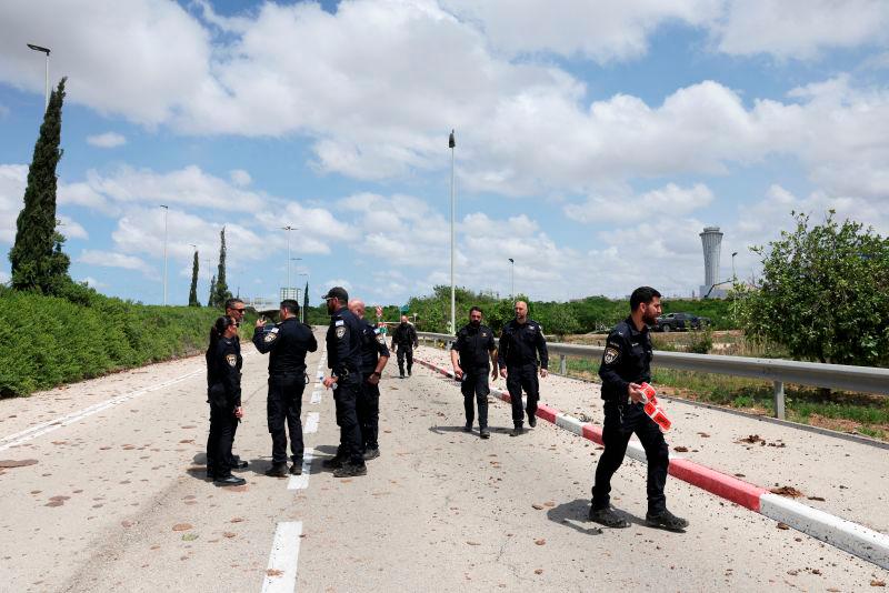 Security forces work at the site of a missile attack, launched from Yemen, at the entrance of Ben Gurion Airport, in Tel Aviv, Israel May 4, 2025. REUTERSpix