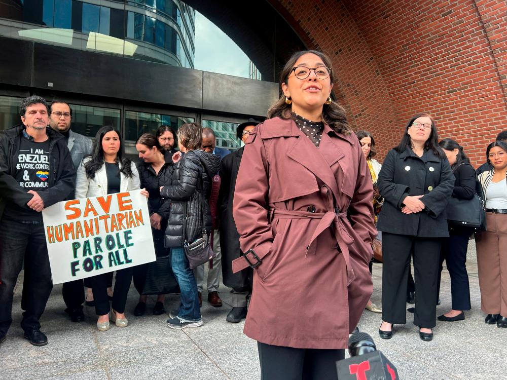 Laura Flores-Perilla, a lawyer with the immigrant rights group Justice Action Center, speaks with reporters about a lawsuit challenging U.S. President Donald Trump's administration's plans to end humanitarian parole programs for migrants, outside the federal courthouse in Boston, Massachusetts, U.S., April 10, 2025. -REUTERSPIX