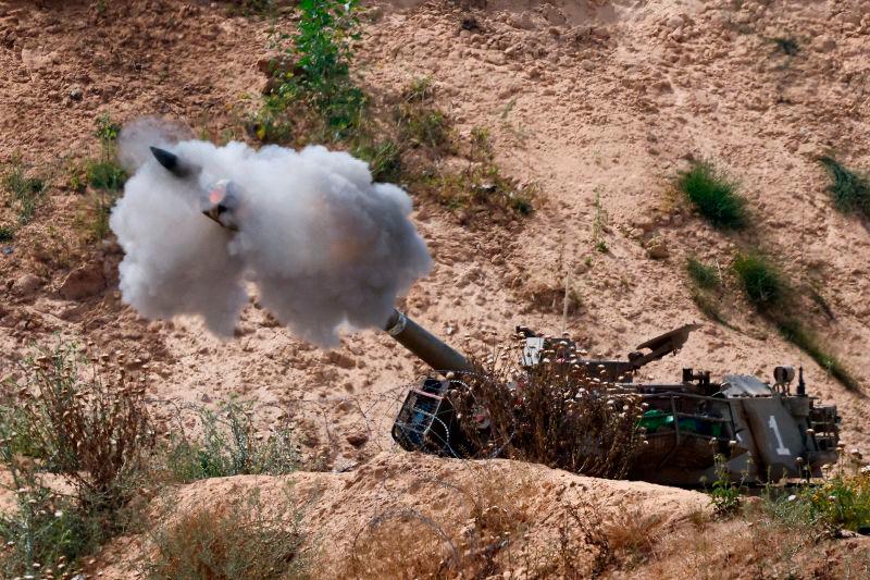 A mobile artillery unit fires towards Gaza, as seen from the Israel, May 6, 2025. REUTERSpix