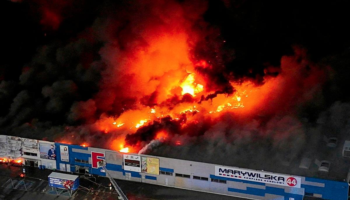 FILE PHOTO: Drone view of the Marywilska 44 shopping centre burning during a massive fire in Warsaw, Poland, May 12, 2024. - REUTERSPIX
