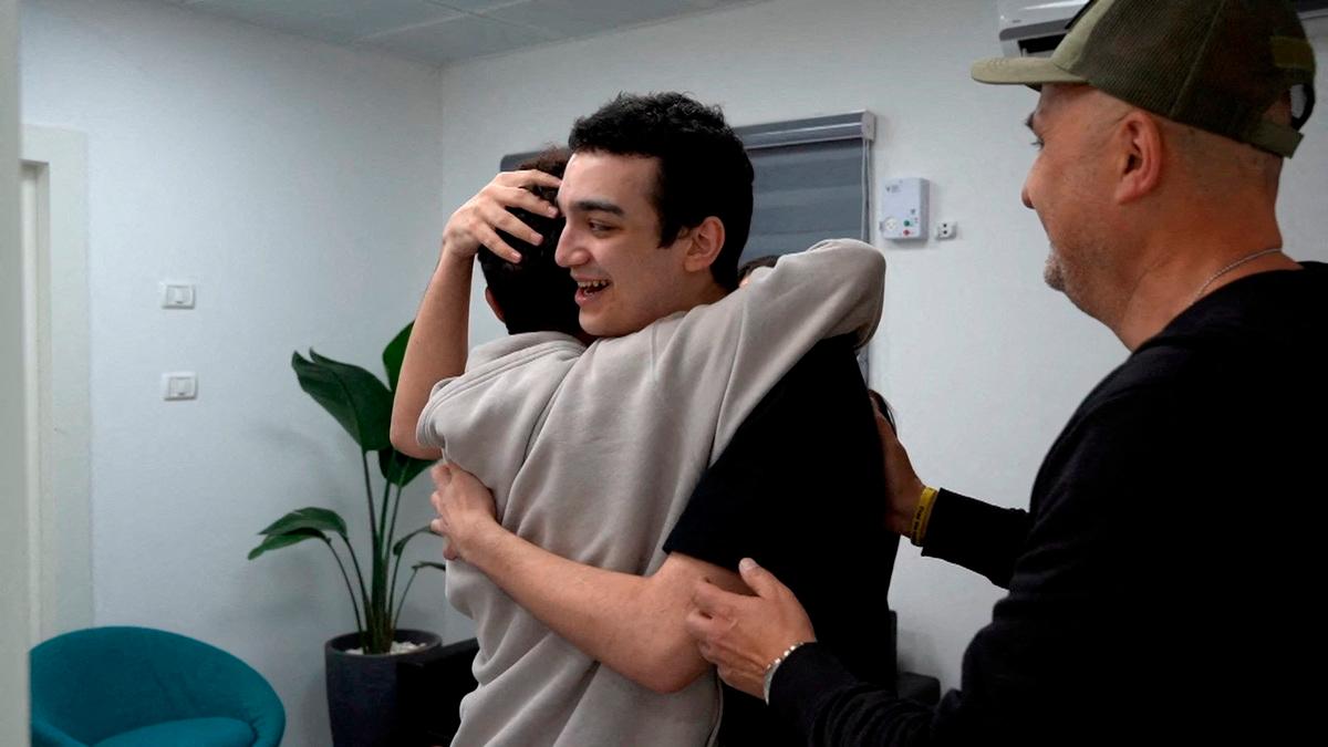 Edan Alexander, who has been released from captivity by Hamas, after he had been kidnapped during the deadly October 7, 2023 attack on Israel, embraces his brother as he reunites with his family in Reim, southern Israel, before flying to Tel Aviv May 12, 2025. - REUTERSpix
