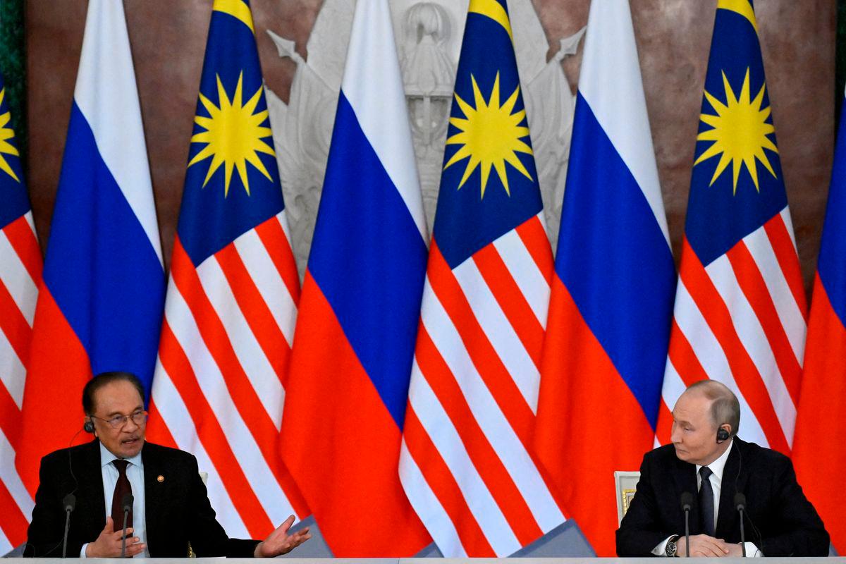 Russian President Vladimir Putin and Malaysian Prime Minister Anwar Ibrahim deliver a joint media statement following their talks at the Kremlin in Moscow, Russia May 14, 2025. Alexander Nemenov/Pool via REUTERS