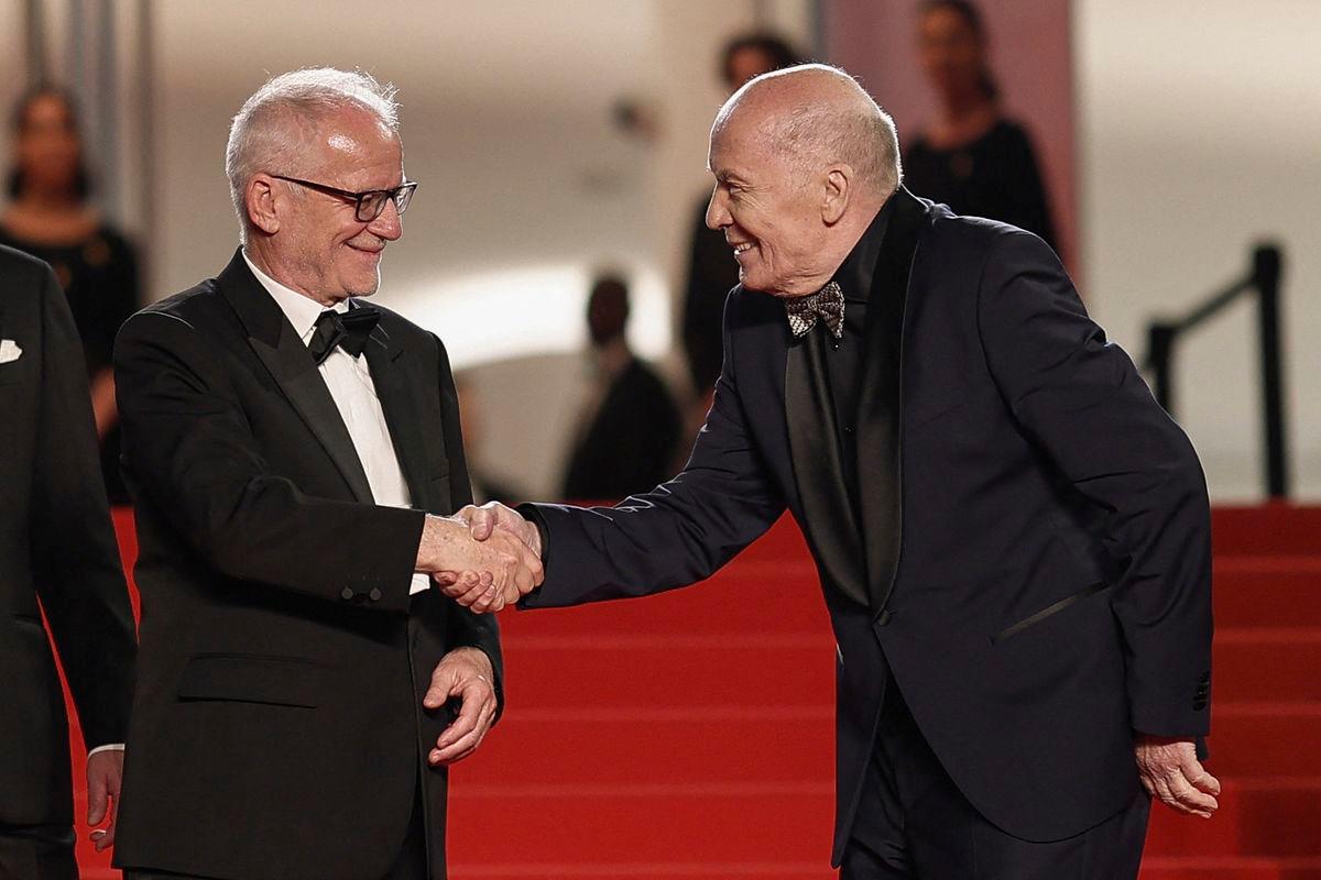 Cannes Film Festival General Delegate Thierry Fremaux shakes hands with cast member Aleksandr Filippenko, as they pose on the red carpet during arrivals for the screening of the film “Two Prosecutors” (Deux procurers) in competition at the 78th Cannes Film Festival in Cannes, France, May 14, 2025. REUTERSpix