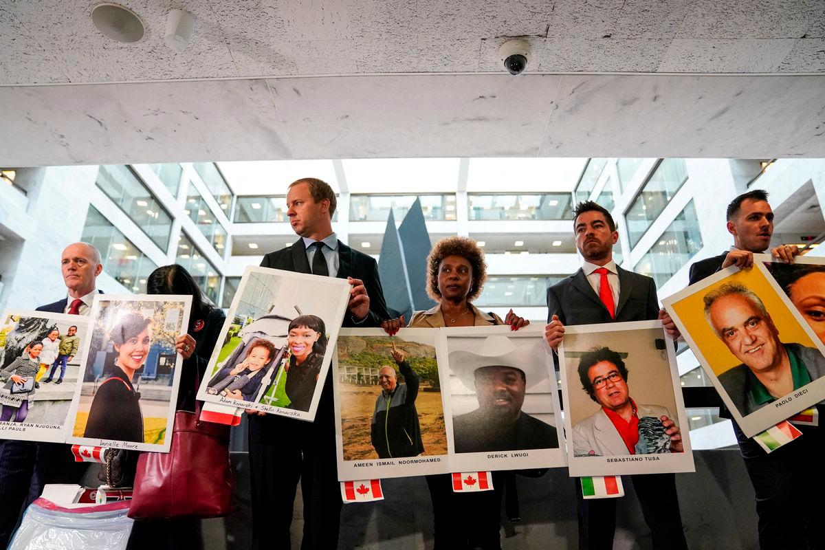 Family members hold photographs of Boeing 737 MAX crash victims lost in two deadly 737 MAX crashes that killed 346 people as they arrive for Boeing CEO Dennis Muilenburg’s testimony. October 29, 2019. REUTERSpix