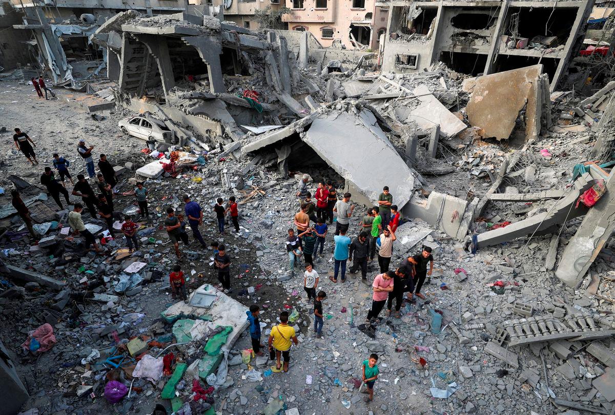 Palestinians inspect the site of an Israeli strike on a house, in Jabalia, northern Gaza Strip May 18, 2025. - REUTERSPIX