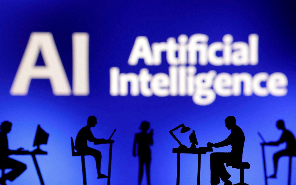 Figurines with computers and smartphones are seen in front of the words “Artificial Intelligence AI” in this illustration taken, February 19, 2024. REUTERSpix