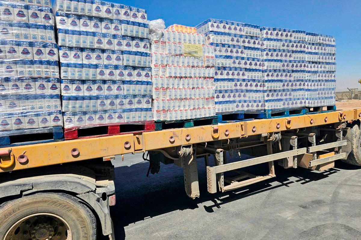 A truck loaded with aid is seen at the Kerem Shalom crossing between Israel and Gaza, on its Israeli side in this handout image obtained by Reuters on May 20, 2025.. REUTERSpix