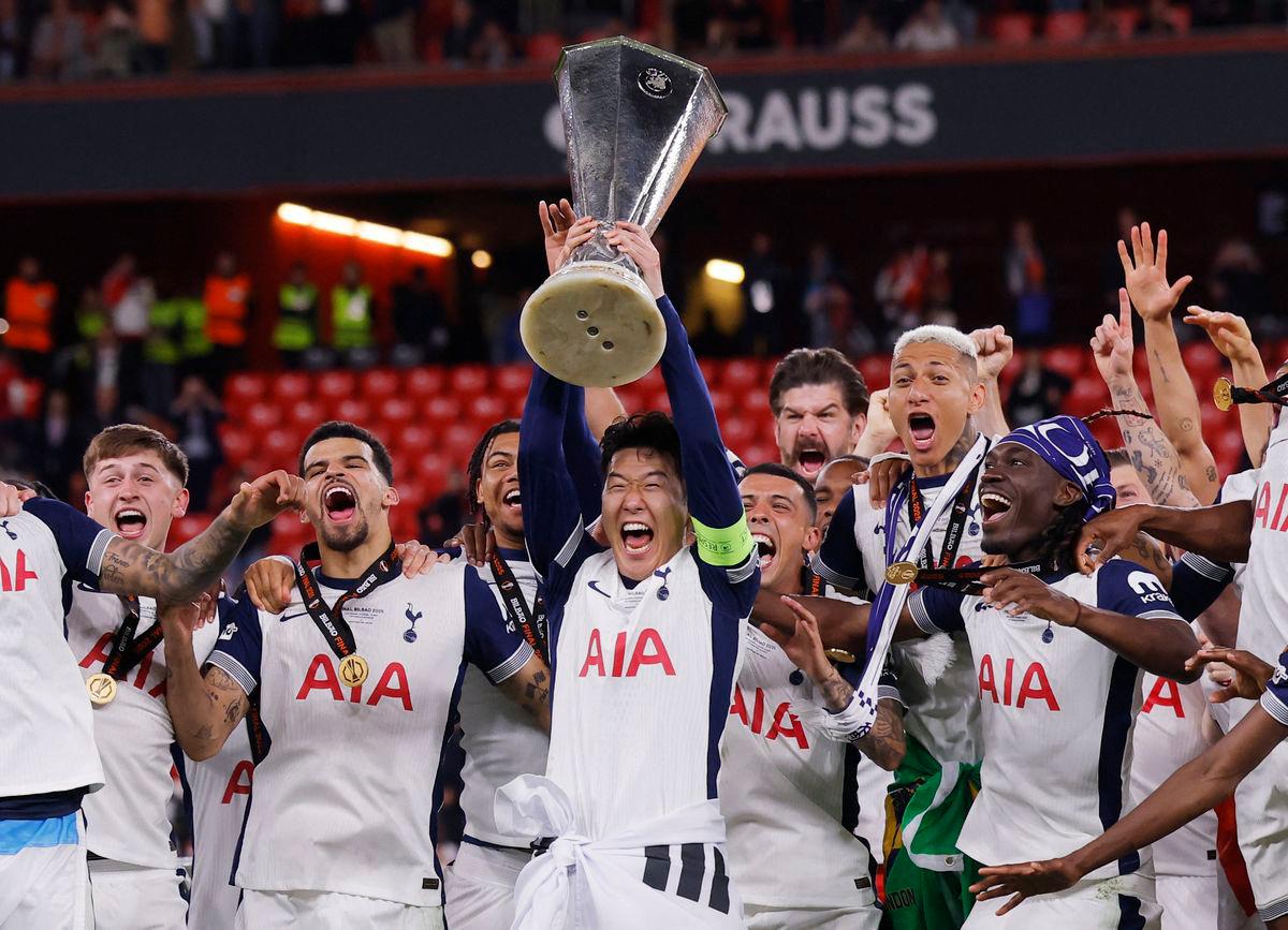 Tottenham Hotspur’s Son Heung-min lifts the trophy with teammates after winning the Europa League Final REUTERSpix