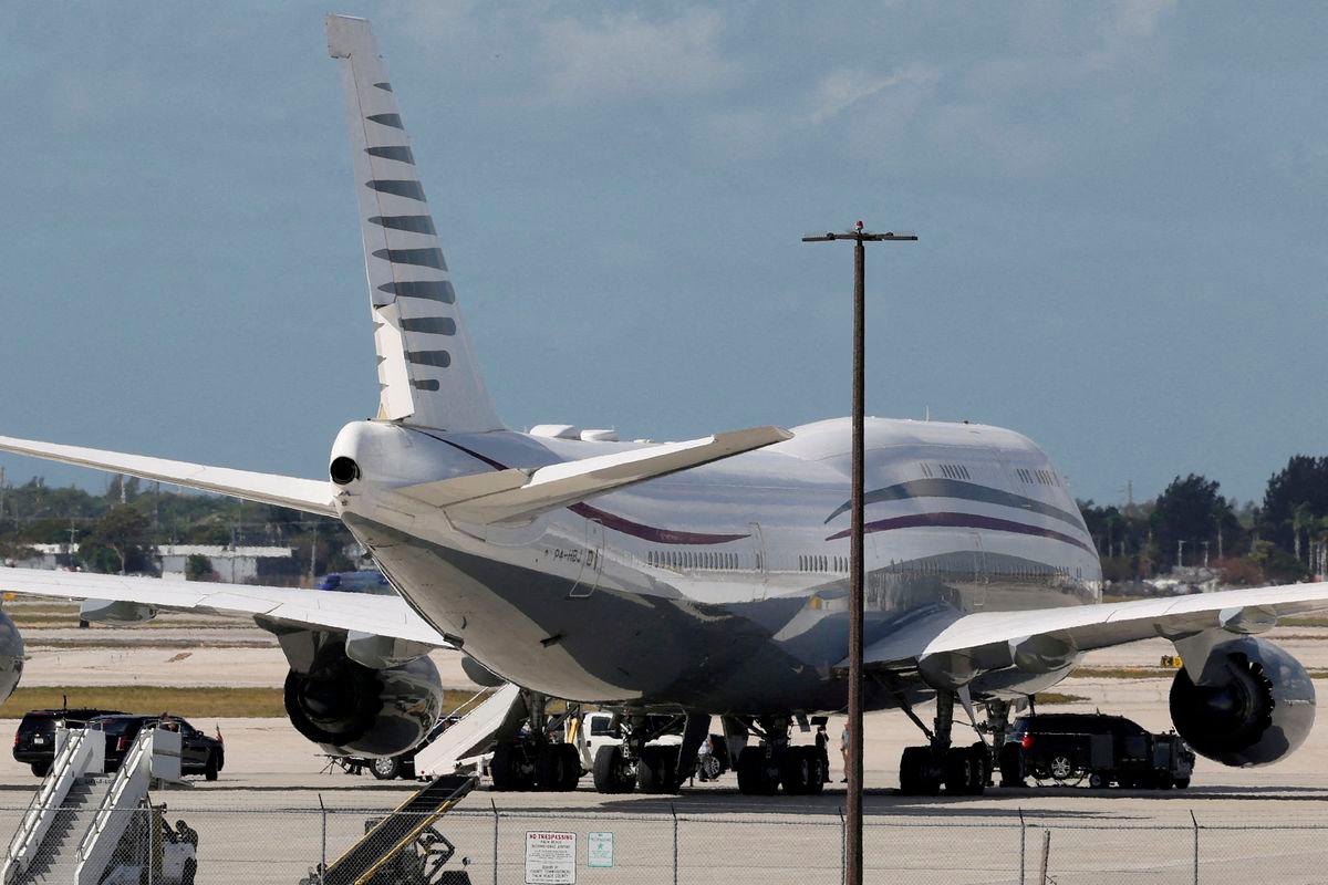 The motorcade of U.S. President Donald Trump is parked next to a 12-year old Qatari-owned Boeing 747-8 that Trump was touring in West Palm Beach, Florida, U.S., February 15, 2025. REUTERSpix