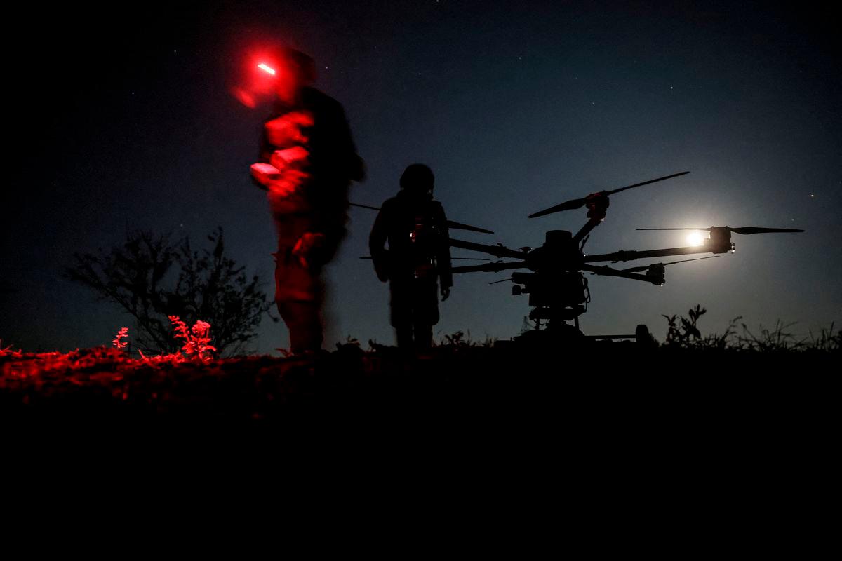 Servicemen of 24th Mechanized Brigade named after King Danylo of the Ukrainian Armed Forces stand near a Kazhan heavy combat drone before flying it over positions of Russian troops, amid Russia’s attack on Ukraine, near the frontline town of Chasiv Yar in Donetsk region, Ukraine May 15, 2025. REUTERSpix