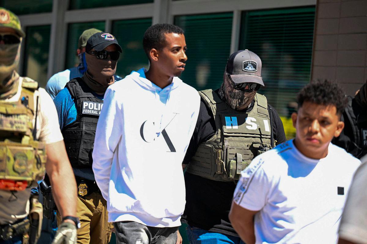 Law enforcement officers, including HSI and ICE agents, take people into custody at an immigration court in Phoenix, Arizona, U.S., May 21, 2025. REUTERSpix