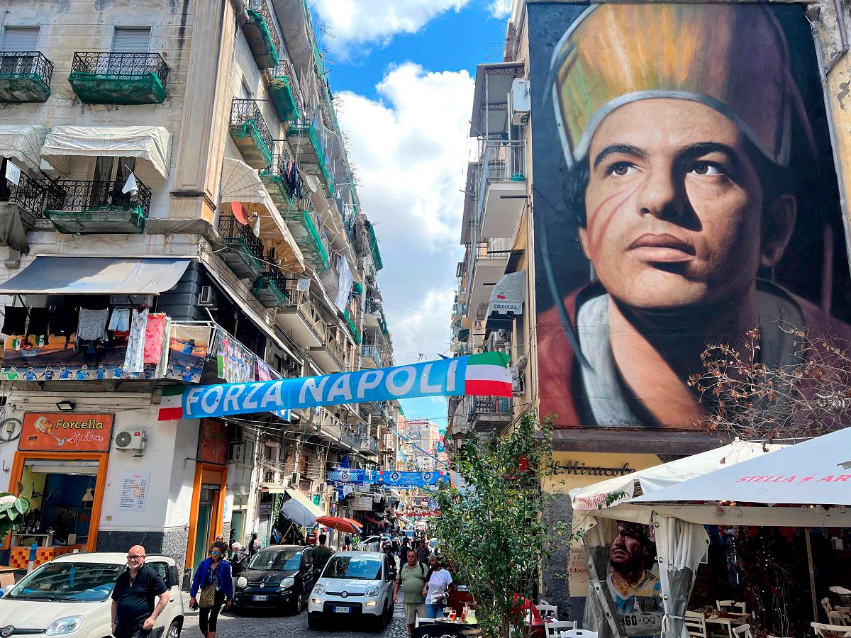 Napoli v Cagliari Previews - Naples, Italy - May 21, 2025 A mural of San Gennaro, the patron saint of Naples is seen above a decorated street in Naples ahead of the match. - REUTERS/Ian Ransom