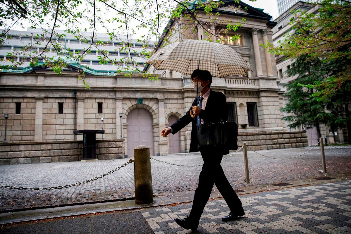 For visual purposes only - A person walks in front of the bank of Japan building in Tokyo, Japan, April 7, 2023. REUTERSpix