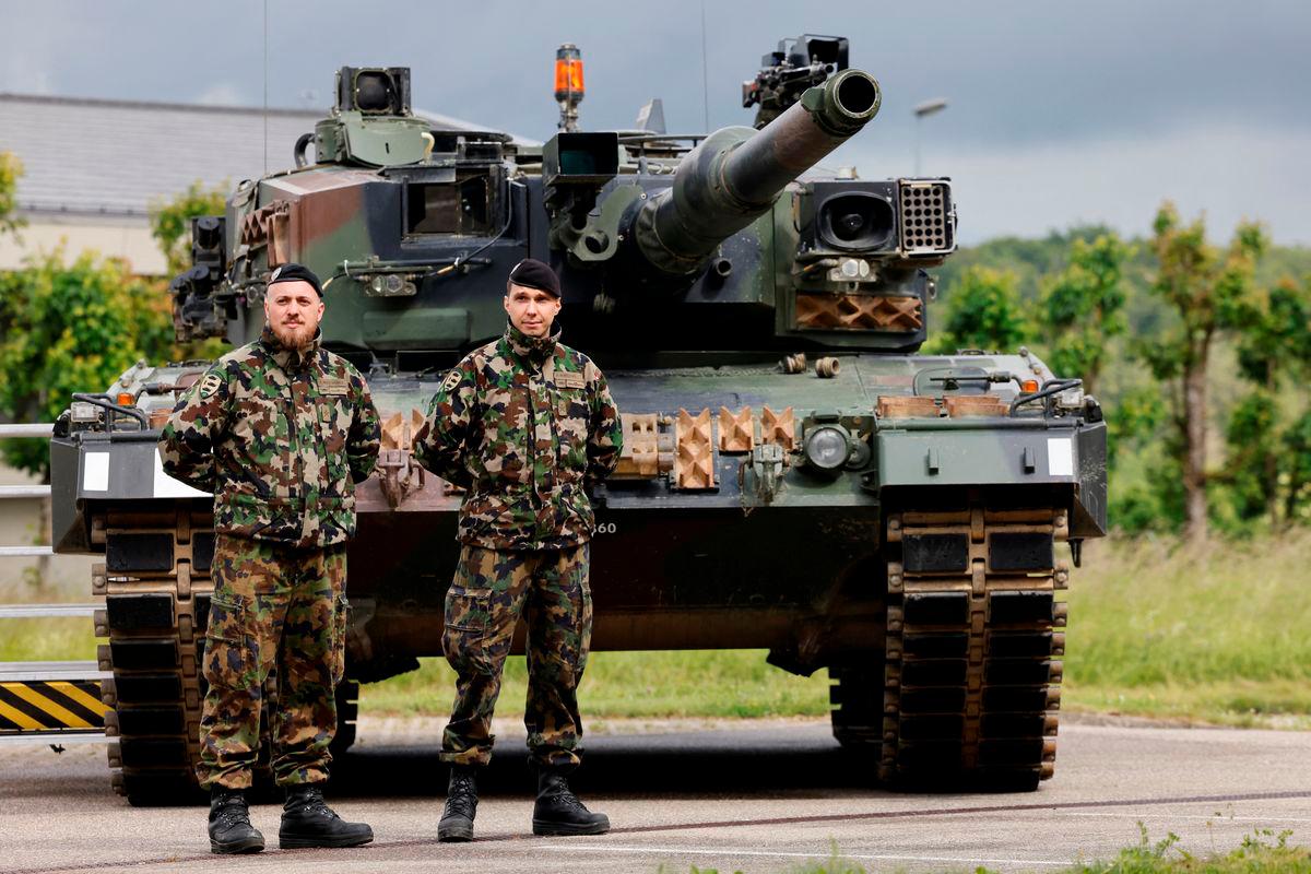 Soldiers stand in front of a LEO 2 tank at a Swiss army base in Bure, Switzerland May 26, 2025. REUTERSpix