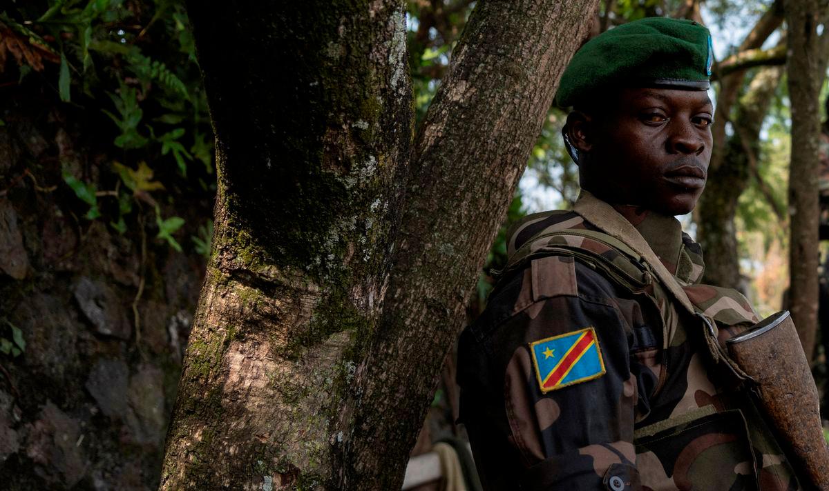 FILE PHOTO: A Congolese soldier stands guard as he waits for the ceremony to repatriate the two bodies of South African soldiers killed in the ongoing war between M23 rebels and the Congolese army in Goma, North Kivu province of the Democratic Republic of Congo February 20, 2024. REUTERSpix