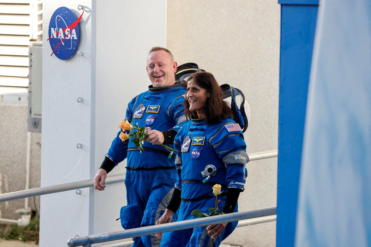 NASA astronauts Butch Wilmore and Suni Williams walk at NASA’s Kennedy Space Center, ahead of Boeing’s Starliner-1 Crew Flight Test (CFT) mission on a United Launch Alliance Atlas V rocket to the International Space Station, in Cape Canaveral, Florida, U.S., June 5, 2024. - REUTERSpix