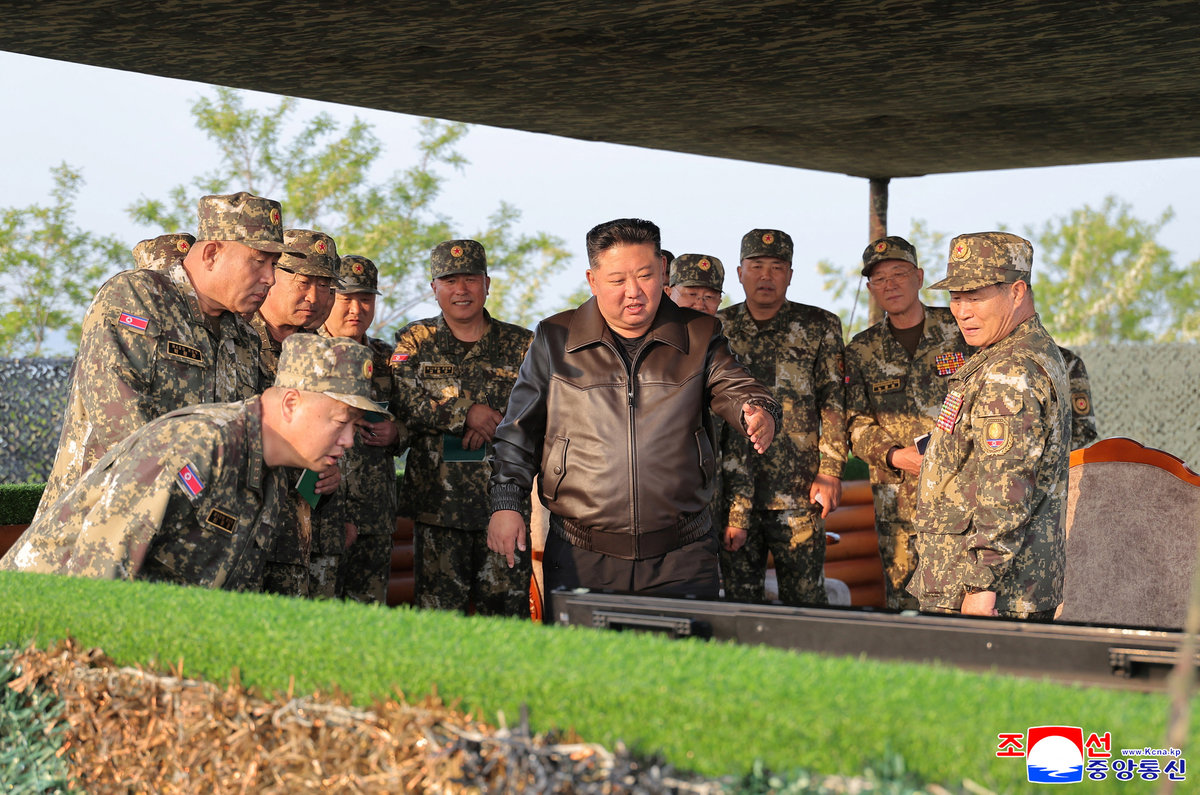 North Korean leader Kim Jong Un gestures on the day he inspects an artillery drill in this handout picture released on May 30, 2025, by the Korean Central News Agency. - KCNA via REUTERS ATTENTION EDITORS