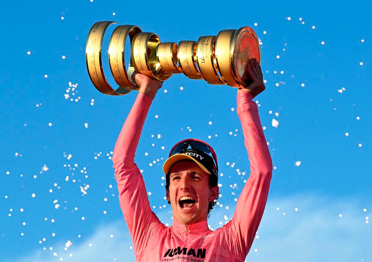 Simon Yates celebrates with a trophy on the podium after winning the Giro d’Italia REUTERSpix