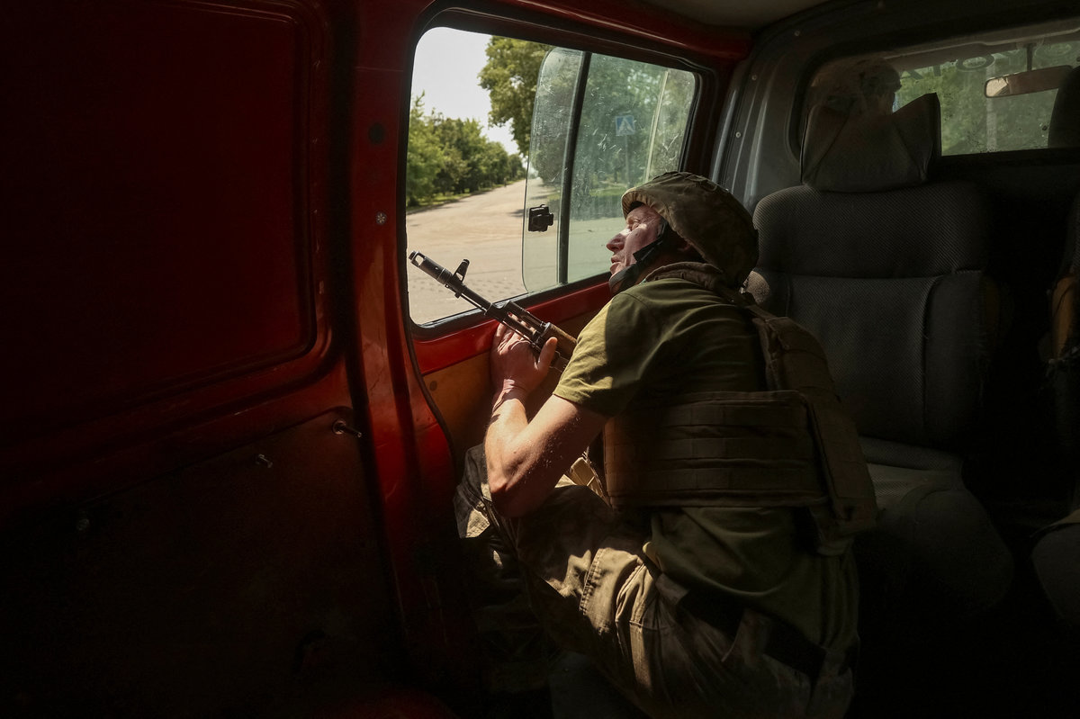 A serviceman of the 28th Separate Mechanized Brigade of the Ukrainian Armed Forces checks an area for drones as he rides in a car, amid Russia’s attack on Ukraine, near the frontline city of Toretsk in Donetsk region, Ukraine June 2, 2025. - REUTERSpix