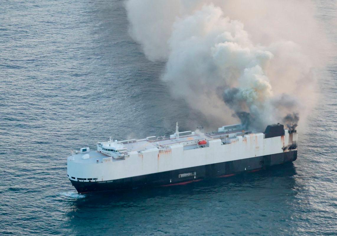 Smoke rises from a fire aboard the cargo vessel Morning Midas, carrying around 3,000 vehicles, including 800 electric vehicles, as seen in an aerial photograph taken from a U.S. Coast Guard C-130J Super Hercules, approximately 300 miles south of Adak, Alaska, U.S. June 3, 2025. - REUTERSPIX