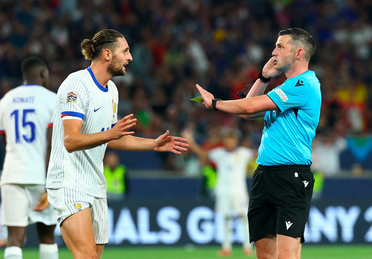 For representational purposes only.France’s Adrien Rabiot with referee Michael Oliver after conceding a penalty REUTERS