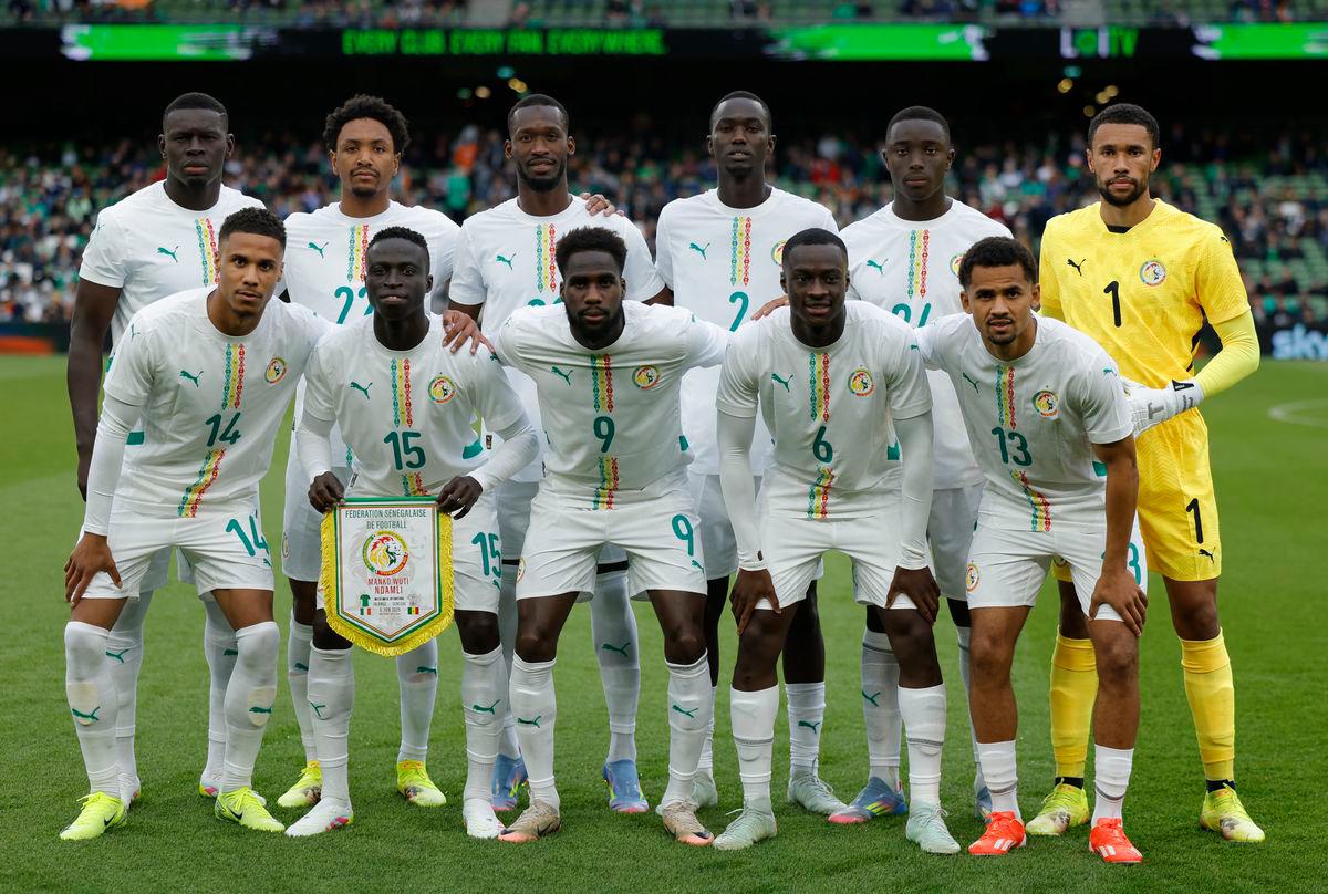 Senegal players pose for a team group photo before the match REUTERS