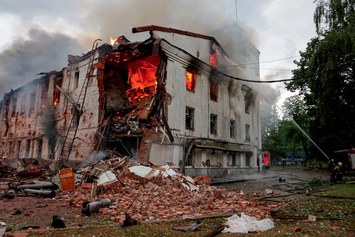 Firefighters work at the site of a building hit by a Russian drone strike, amid Russia's attack on Ukraine, in Kharkiv, Ukraine June 7, 2025. - REUTERSPIX