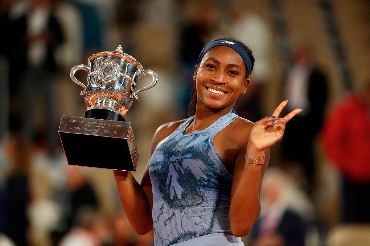 Coco Gauff of the U.S. celebrates with the trophy after winning the women’s singles final against Belarus’ Aryna Sabalenka - REUTERS