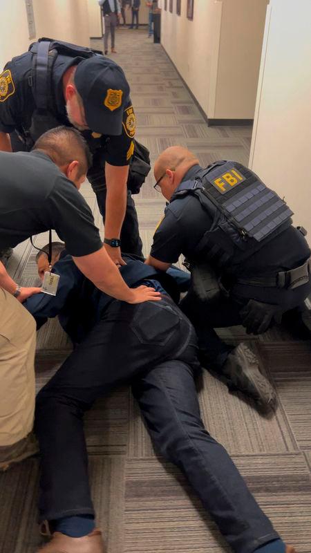 U.S. Senator Alex Padilla (D-CA) is held down on the floor - Office of the Senator Alex Padilla/Handout via REUTERS