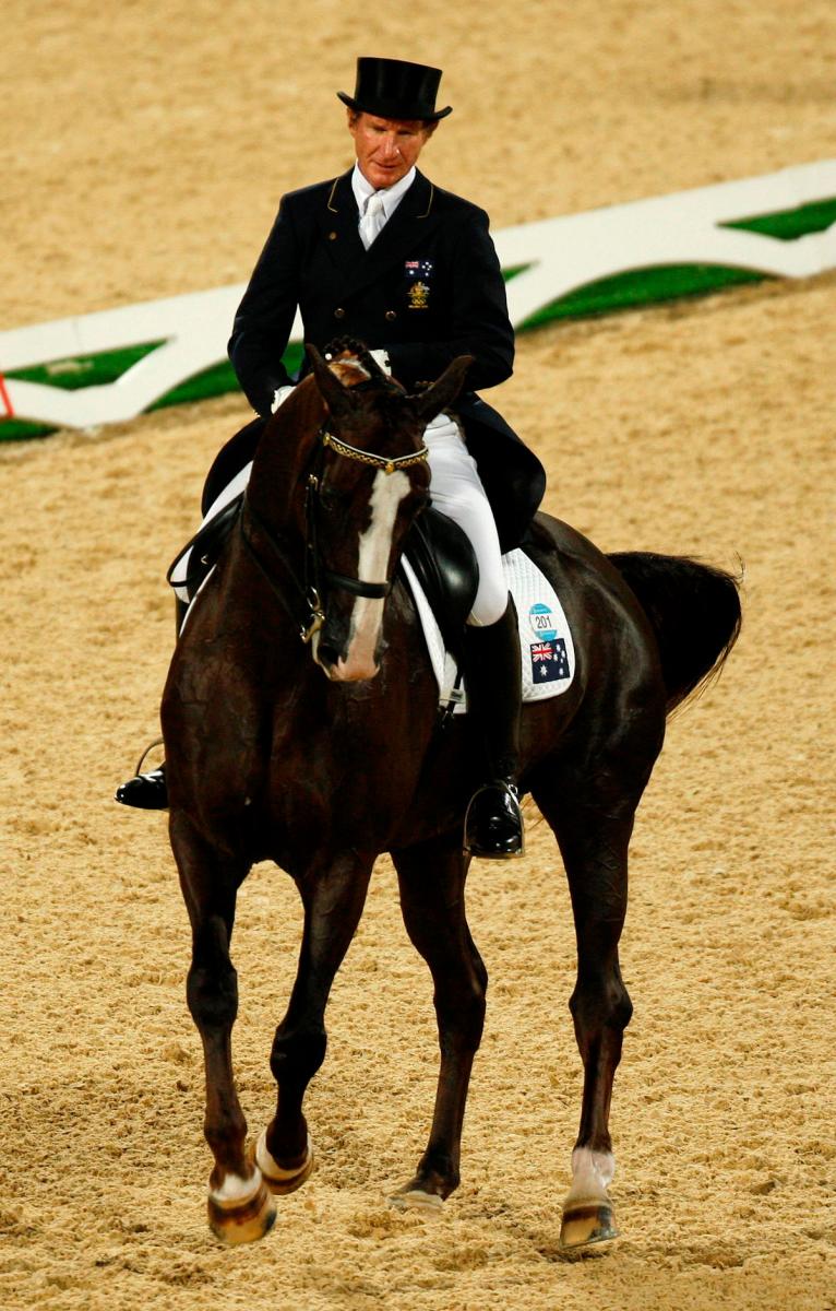 FILE PHOTO: Heath Ryan of Australia riding Greenoaks Dundee during the Equestrian Dressage Grand Prix competition at the Beijing 2008 Olympic Games in Hong Kong August 13, 2008. REUTERSpix