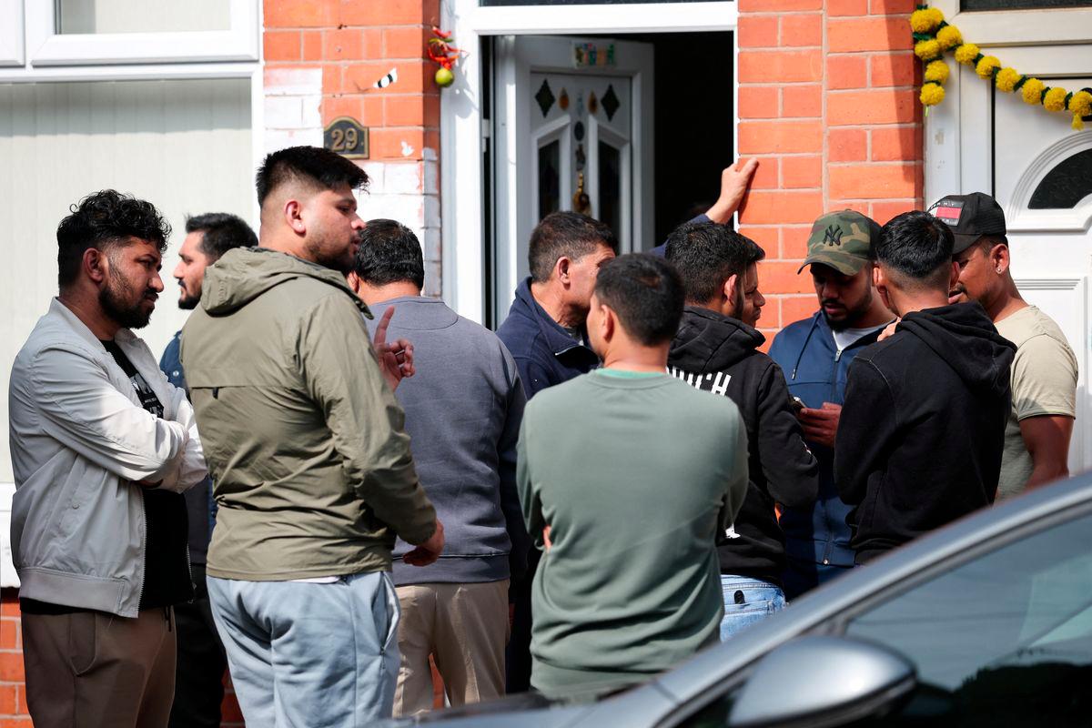 Members of local community stand outside the family home of Ramesh Viswashkumar, a British survivor of the London-bound Air India aircraft crash near Ahmedabad Airport in India, in Leicester, Britain, June 13, 2025. - REUTERSPIX