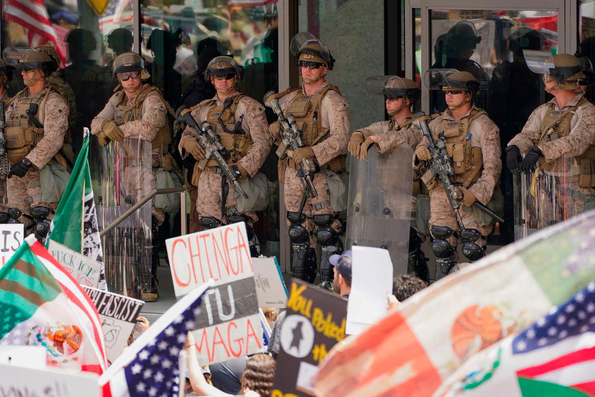 U.S. Marines stand watch as people protest against U.S. President Donald Trump’s policies and federal immigration sweeps during a No Kings Day demonstration in Los Angeles, California, U.S., June 14, 2025. REUTERSpix