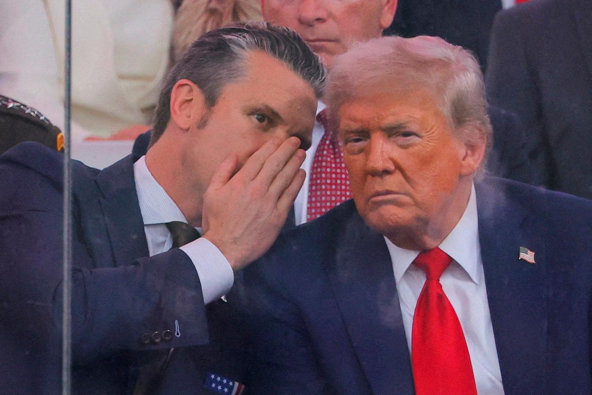U.S. Secretary of Defense Pete Hegseth talks to U.S. President Donald Trump during the U.S. Army’s 250th Birthday parade, on the same day of U.S. President Donald Trump 79th birthday, in Washington, D.C., U.S., June 14, 2025. - REUTERS/Carlos Barria/File Photo