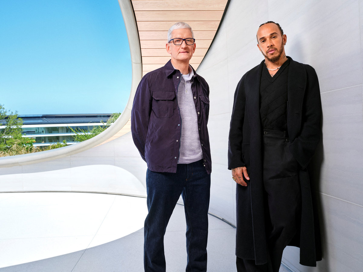 Apple CEO Tim Cook and Formula One driver Lewis Hamilton pose for a publicity photo at Apple Park in Cupertino, California, U.S., April 28, 2025. - Apple/Handout via REUTERS