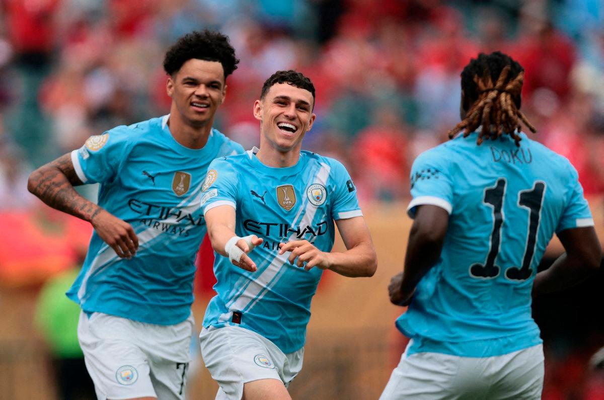 Manchester City’s Phil Foden celebrates scoring their first goal with Nico O’Reilly and Jeremy Doku IMAGN IMAGES via REUTERSpix