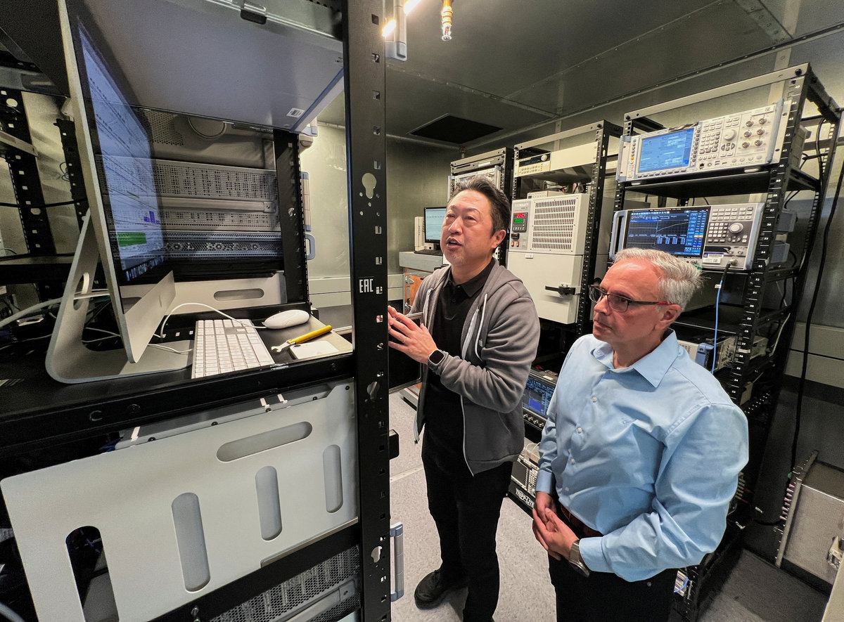 Johny Srouji (R), senior vice president of hardware technologies at Apple, and an Apple engineer view testing data on Apple’s new C1 cellular modem in a shield room that blocks interference from cellular networks at Apple’s wireless labs, in Sunnyvale, California, U.S., February 18, 2025. - REUTERSpix