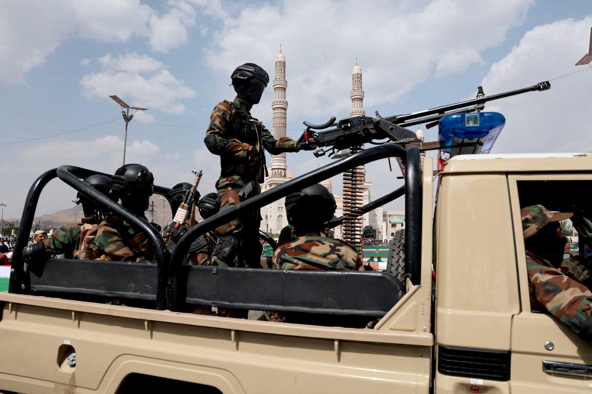 Houthi police officers patrol on a vehicle the site of a rally held by protesters, predominantly Houthi supporters, in solidarity with Palestinians and Iran, amid the Iran-Israel conflict, in Sanaa, Yemen June 20, 2025. - REUTERSPIX