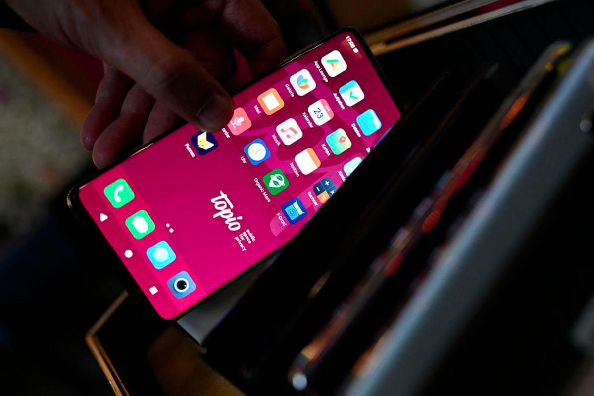 An alternative mobile operating system smartphone is pictured at the Topio organization’s market stall, which offers support for the transition to alternative operating systems for smartphones, tablets, and laptops, moving away from major tech companies like Google and Apple, in Berlin, Germany, April 23, 2025. - REUTERSPIX