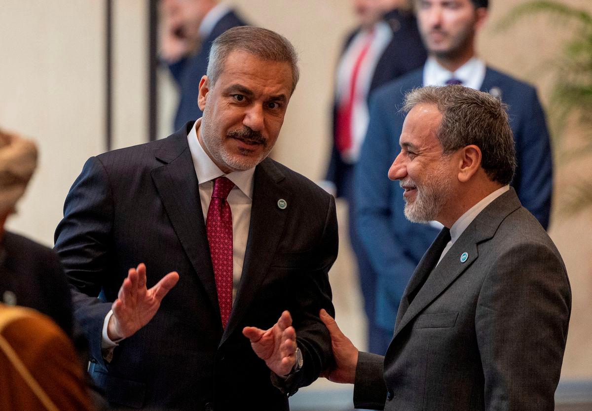 Iranian Foreign Minister Abbas Araghchi talks with Turkish Foreign Minister Hakan Fidan during the 51st Session of the Council of Foreign Ministers of the Organisation of Islamic Cooperation (OIC) in Istanbul, Turkey, June 21, 2025. - REUTERSPIX