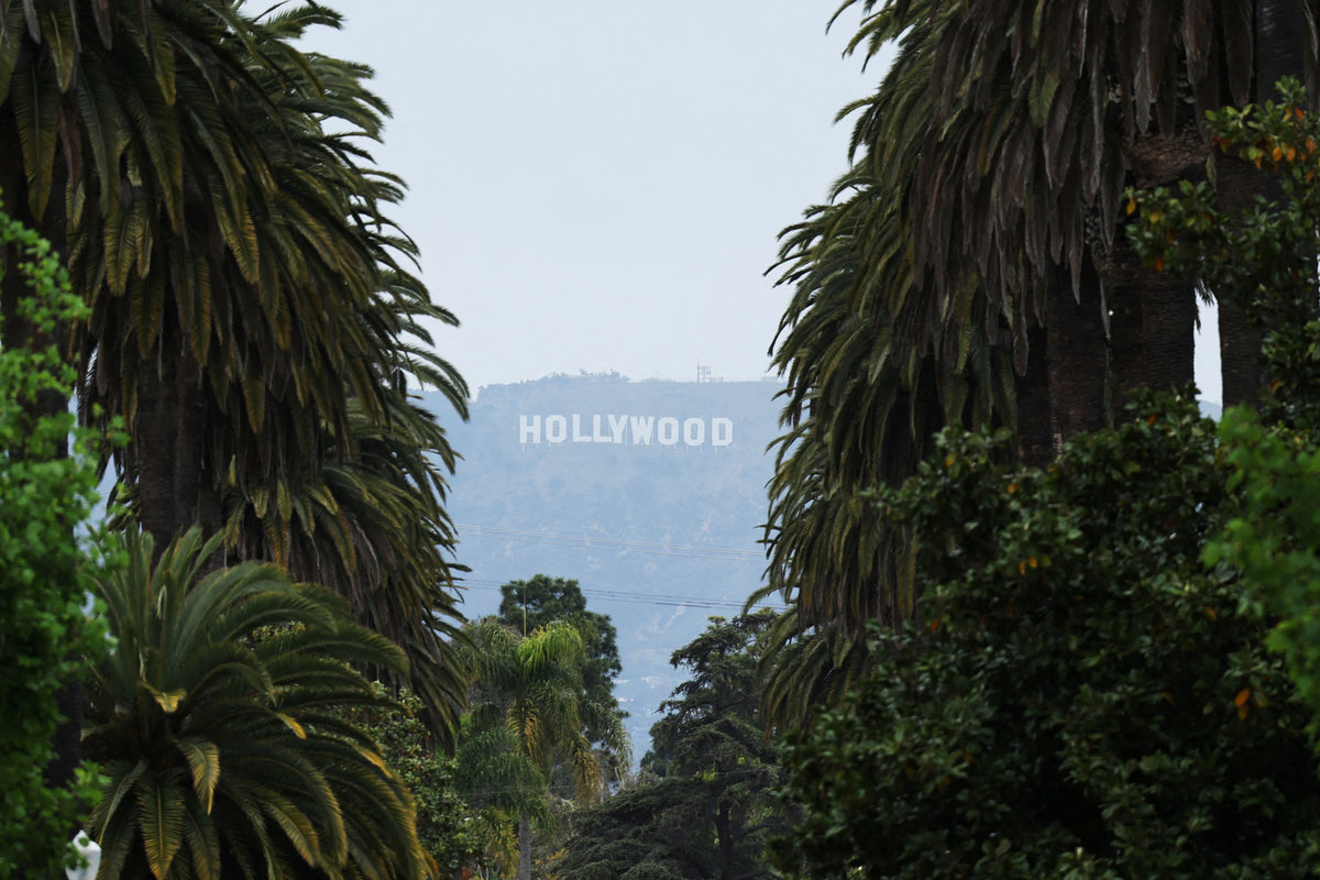 The Hollywood Sign is framed by palm trees as U.S. President Donald Trump unveils a 100% tariff on films made outside of the U.S., in Los Angeles, California, U.S. May 5, 2025. - REUTERS