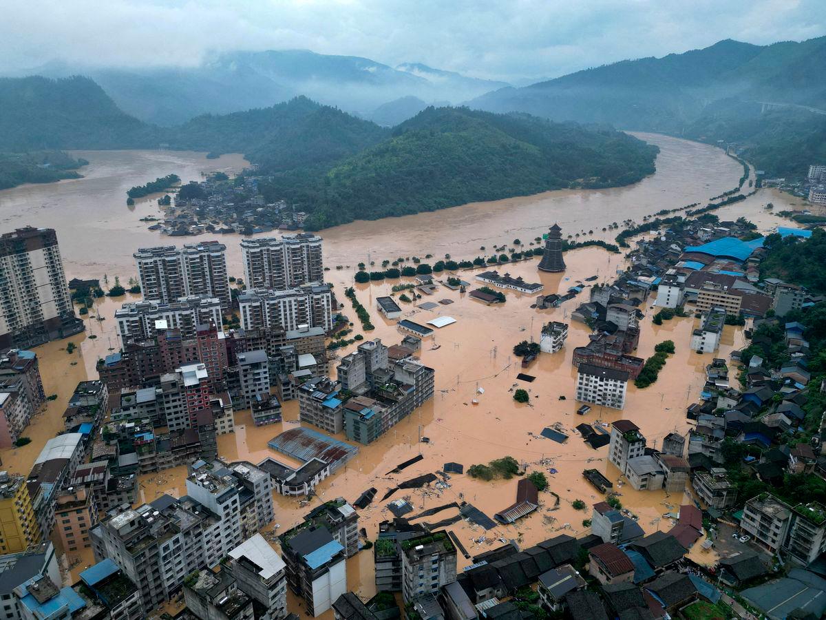 A drone view shows buildings and roads are half submerged in floodwaters after heavy rainfalls, in Rongjiang county, Guizhou province, China June 24, 2025. - REUTERSPIX