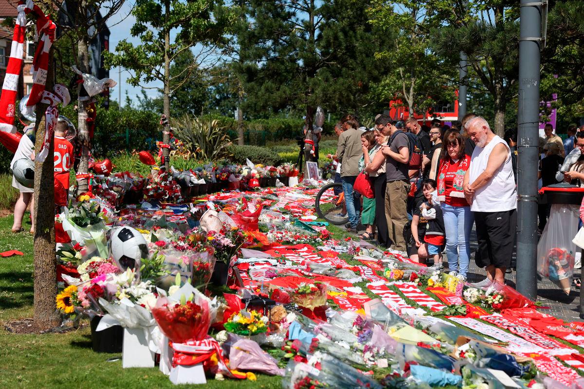 People pay tribute to Liverpool’s Portuguese soccer player Diogo Jota, who died in a car crash near Zamora, Spain, outside Anfield Stadium in Liverpool, Britain, July 3, 2025. REUTERS