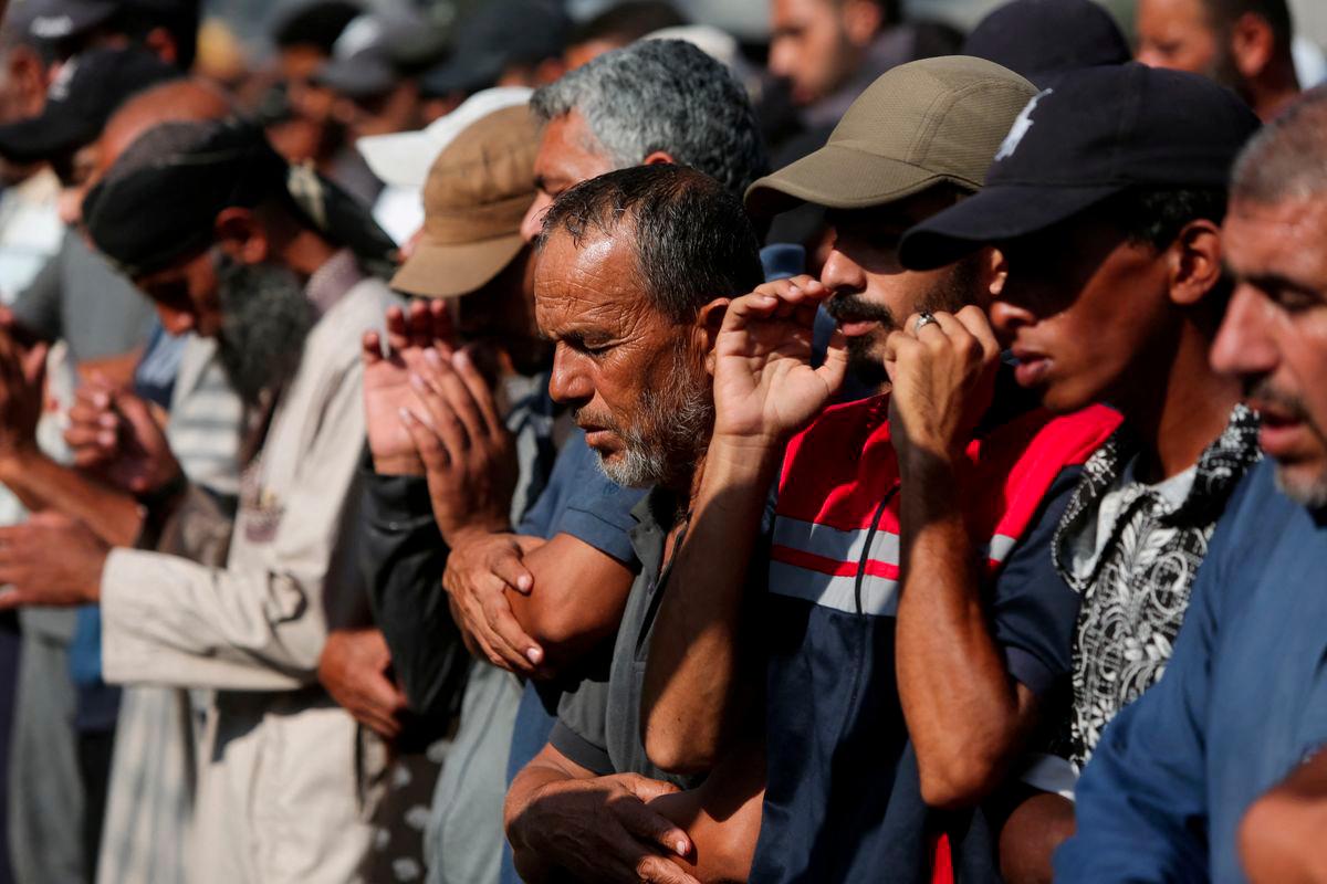 Mourners pray during the funeral of Palestinians killed overnight in Israeli attacks on a tent and on people seeking aid, according to Gaza's health ministry, at Nasser Hospital in Khan Younis, southern Gaza Strip, July 4, 2025. - REUTERSPIX