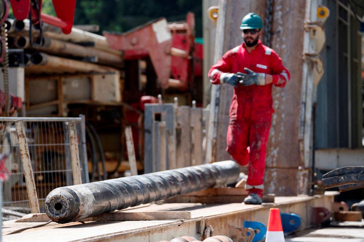 A worker walks next to a drill part during a visit of German Chancellor Olaf Scholz and Bavarian Premier Markus Soeder at a geothermal energy station in Geretsried, Germany, August 24, 2023. - REUTERSPIX