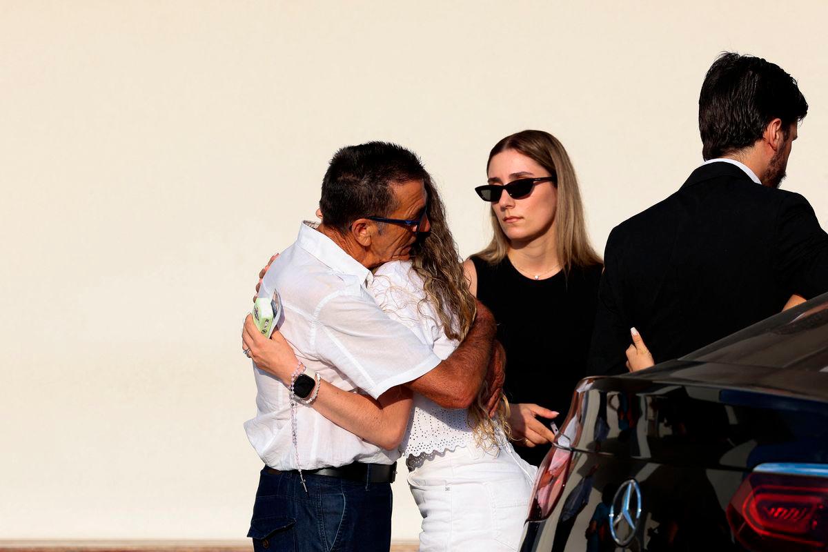 Rute Cardoso is embraced as she arrives on the day of the funeral ceremony of her late husband Liverpool’s Portuguese soccer player Diogo Jota and his brother Andre Silva, who died in a car crash near Zamora, Spain, near the Chapel of the Resurrection, in Gondomar, Portugal, July 5, 2025- REUTERS