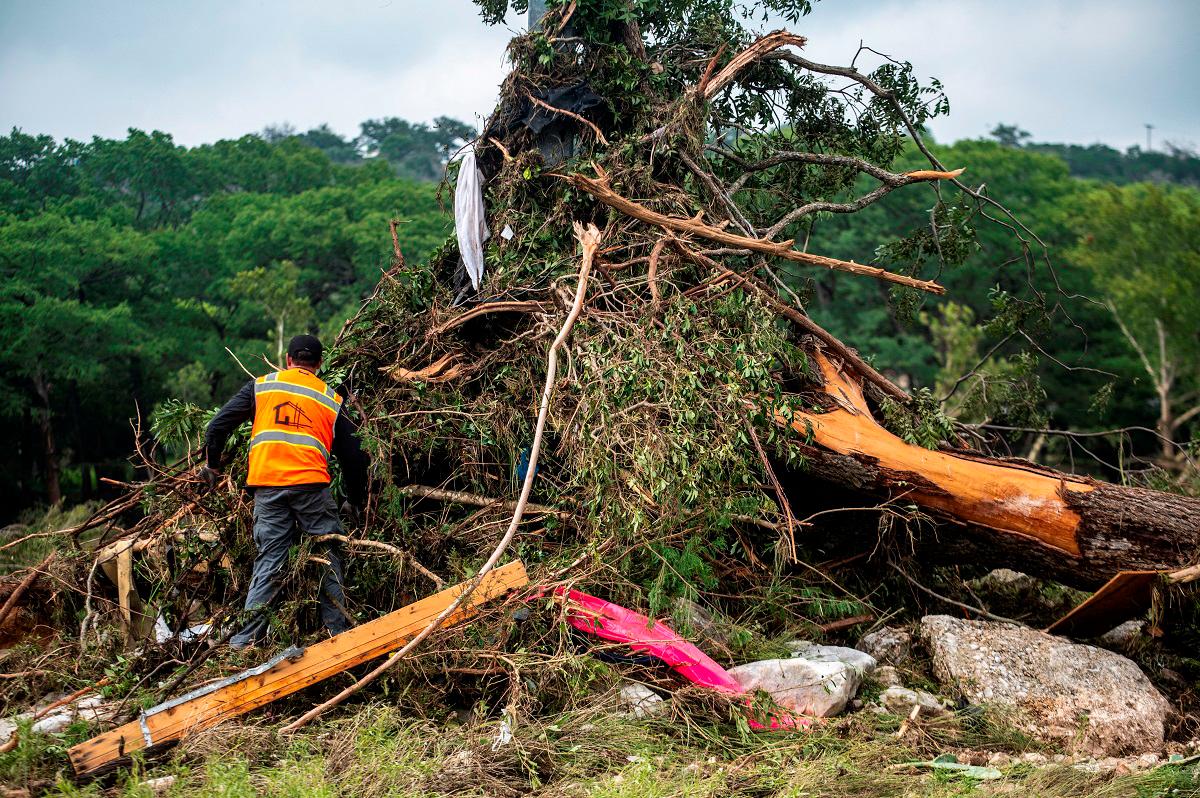 A volunteer rescue worker works after deadly flooding in Kerr County, Texas, U.S., July 5, 2025. - REUTERS/Sergio Flores